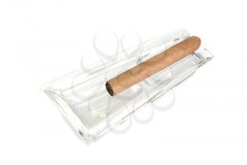 Cigar at ashtray isolated on a white back