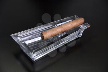 Royalty Free Photo of a Cigar and Ashtray