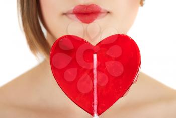 Royalty Free Photo of a Woman Holding a Heart Lollipop 
