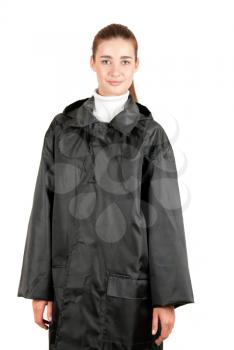 pretty brunette girl at black raincoat on a white