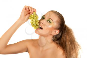 Pretty young woman closeup with grape on the white background