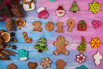Gingerbreads for new 2019 year on wooden background, xmas theme