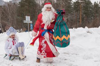 BYURIZOVAYA KATUN. ALTAISKIY KRAI. WESTERN SIBERIA. RUSSIA - DECEMBER 1, 2018: Fathers Frost (Russian Santa Claus) take part in the Santa Run in the Altaiskaya Zimovka holiday - the first day of winter on December 1, 2018 in Altayskiy krai, Siberia, Russia.
