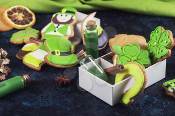 Gingerbreads cookies for Patrick's day on dark concrete background