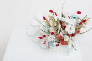 Beauty bouquet of dried flowers on a white