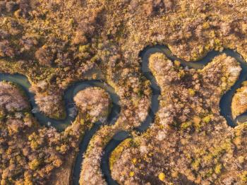Aerial drone view of autumn landscape with river.