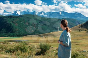 Domestic tourism, travel, lesure concept - woman in Altai mountains, beauty summer day