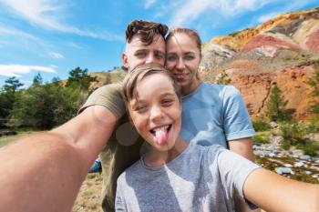 Selfie of family in Altai mountain, beauty summer landcape