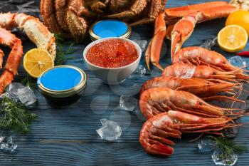 Set of seafood: red and black caviar, limb of hairy crab, limb of snow crab, far eastern kamchatka crab