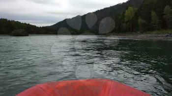 Rafting and boating on the Katun River in the Altai in Russia. First-person view.