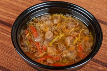 Fresh vegetable soup made of mushrooms, pepper and onion