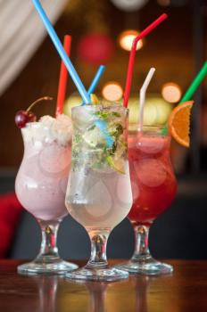 Set of three healthy nonalcoholic cocktails berries and classic mohito