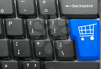 Close-up of Computer keyboard,  with blue Shopping key