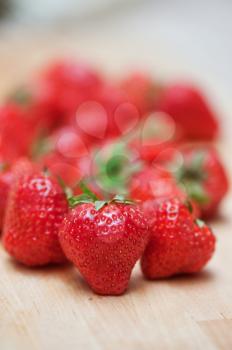 Fresh strawberries  at wooden background