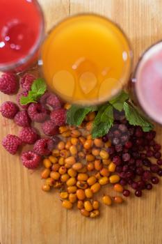 set of fruit non-alcoholic drink with cranberries raspberries and sea buckthorn