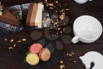 Table with cakes ans coffee cup