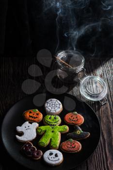 Homemade delicious ginger biscuits for Halloween on wooden table