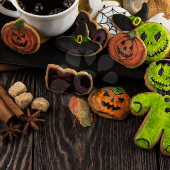 Homemade delicious ginger biscuits for Halloween on wooden table