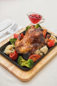 Roasted chicken with vegetables. Thanksgiving or christmas theme.