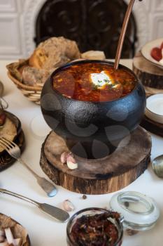 Russian borsch at pot on the table