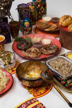 Table with traditional russian food decorated in russian style