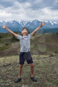 Teen boy on he the Altai Mountains background