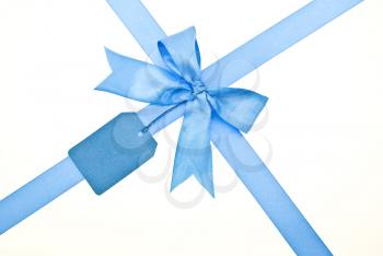 Royalty Free Photo of a Blue Bow With Label
