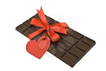 Black chocolate with red ribbon and tag heart 