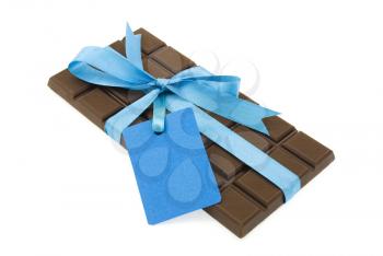 Black chocolate with blue ribbon and tag 