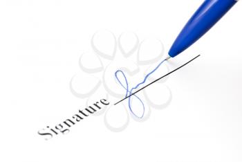Royalty Free Photo of a Pen Making a Signature