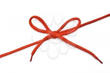 Royalty Free Photo of a Red Shoelace With Bow