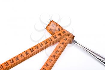 Royalty Free Photo of a Fork and Measuring Tape