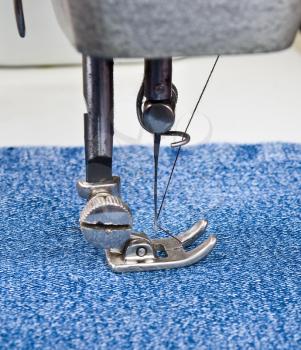 Royalty Free Photo of a Sewing Machine With Denim