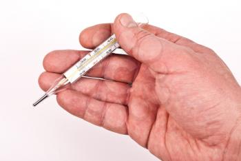 Royalty Free Photo of a Hand Holding a Thermometer