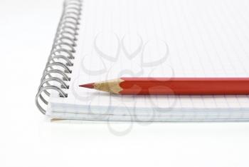 Royalty Free Photo of a Spiral Notepad With Pencils