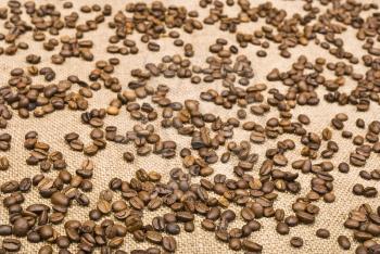 Royalty Free Photo of a Coffee Bean and Sackcloth Background