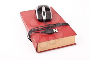 Royalty Free Photo of a Mouse Wrapped Around a Book