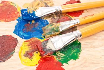 Royalty Free Photo of an Artist's Palette With Brushes 