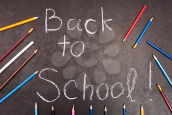 Royalty Free Photo of Back to School Written on Chalkboard