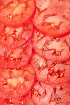 Pattern of red sliced tomatoes