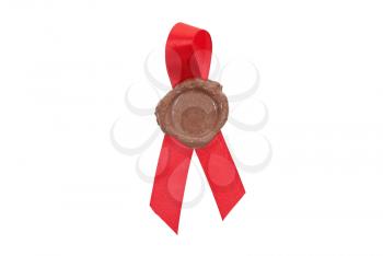 Round red wax seal on a red ribbon