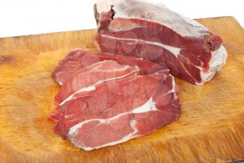 Royalty Free Photo of Slabs of Meat on a Cutting Board