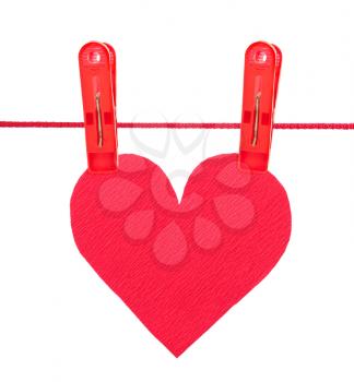 Red heart on the clothespins