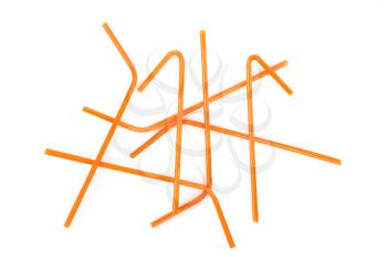 Orange straws on white background
