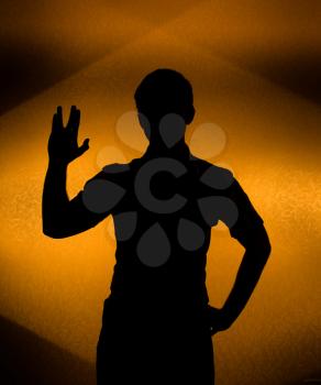 Live long -  Back lit silhouette of man with raised hand