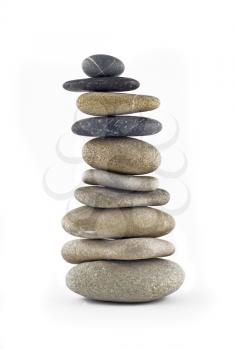 Balanced stone stack or tower isolated over white background