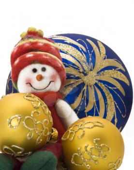 Christmas decoration toy with three colorful New Year Balls. Focus on the back objects