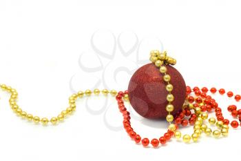 Christmas is coming. Red Decoration ball, red and golden tinsel over white background