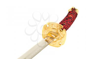 Closeup of golden katana sword isolated on white