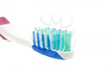 Healthy lifestyle - extreme closeup of toothbrush on white